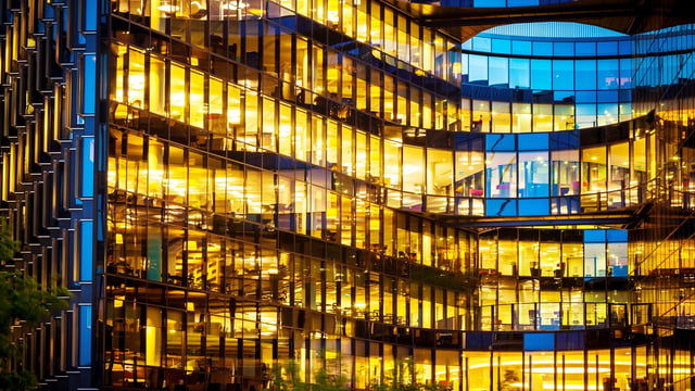 Glass building with lights on